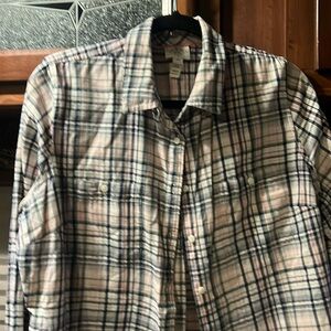 Long sleeve plaid button up shirt.